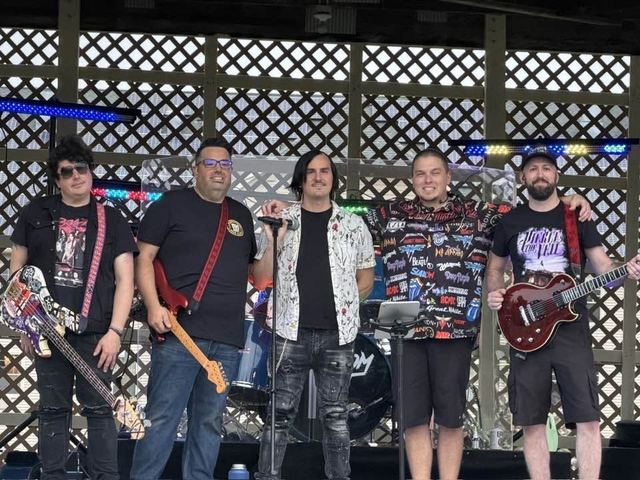 All five members of Random Riot on stage at Mole Lake Casino